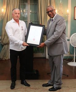 Calvin Ayre receives Antigua’s Faithful & Meritorious Service Cross Award