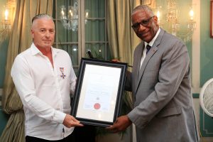 Calvin Ayre receives Antigua’s Faithful & Meritorious Service Cross Award